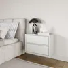 A modern bedroom setting with a bed and a nightstand. Produktbild-Vorschau