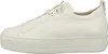 A side view of a white leather sneaker on a white background. Voir les images du produit