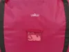 Close-up of a pink bag with a brand logo and a clear window. Náhled obrázku produktu