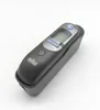 A black Braun thermometer is placed in its black charging base against a white background. Produktbild-Vorschau