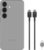 A silver Samsung smartphone with two USB-C cables and a SIM ejector tool on a white background. Produktbild-Vorschau