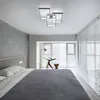 A bedroom scene with a bed, a window with blinds, and a ceiling light. Náhled obrázku produktu