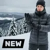 A man wearing winter clothing and gloves in a snowy mountain landscape. Produktbild-Vorschau