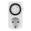 A white mechanical timer plug with a dial and a socket. Produktbild-Vorschau
