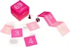 A board game with pink cards and a pink box, laid out on a white surface. Náhľad obrázku produktu