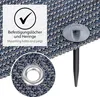 Close-up view of a camping carpet with mounting holes and pegs, showing a detail of the grommet. Produktbild-Vorschau