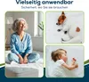 A collage showing an older woman sitting on a mattress, a sleeping puppy on a white pad, and a sleeping baby on a white pad. Produktbild-Vorschau
