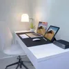A clean and modern desk setup with a laptop and tablet. Produktbild-Vorschau