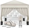 A beige pop-up gazebo with its accessories laid out in front of it, including a carrying bag, weights, and stakes. Voir les images du produit