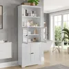A white bathroom cabinet with glass doors and wooden doors, filled with toiletries and towels, is shown in a well-lit bathroom setting. Náhled obrázku produktu