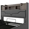 Close-up view of a bed frame with a headboard featuring storage compartments. Podgląd zdjęcia produktu