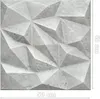 A 3D decorative wall panel with a geometric, faceted design, resembling concrete. Anteprima dell’immagine prodotto