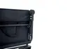A close-up view of the corner of a black foldable wagon, showing the fabric and metal frame. Produktbild-Vorschau