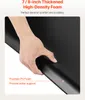 A hand pressing down on a black foam mat. Podgląd zdjęcia produktu