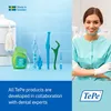 A split image showing dental hygiene products on the left and a smiling dentist on the right. Produktbild-Vorschau