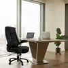 An office setting with a desk, chair, and laptops. Produktbild-Vorschau