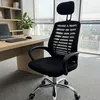 An office chair is placed in front of a desk with a laptop and a plant, with a window in the background. Produktbild-Vorschau