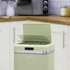 Close-up of the top of a green retro-style trash can with its lid open. Podgląd zdjęcia produktu