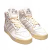 A pair of white Adidas Rivalry Hi sneakers. Produktbild-Vorschau