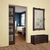 A modern living room with a sliding door, a sofa, and a dresser. Produktbild-Vorschau