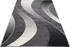 A modern rug with a wavy abstract pattern in shades of gray, black, and white, laid out on a white background. Náhľad obrázku produktu