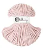 A spool of pastel pink macrame cord on a white background. Produktbild-Vorschau