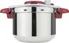 A close-up studio shot of a stainless steel pressure cooker with red handles and lid accents. Produktbild-Vorschau