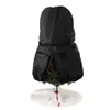 A black Christmas tree storage bag is covering a small artificial Christmas tree, which is standing on a white tree skirt. Produktbild-Vorschau