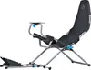 A gaming chair with a steering wheel mount and pedals, shown against a white background. Anteprima dell’immagine prodotto