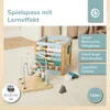 A wooden activity cube and bead maze toy on a textured carpet. Produktbild-Vorschau