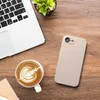 A top-down view of a desk with a laptop, a cup of coffee with latte art, and a smartphone. Produktbild-Vorschau