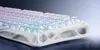 A close-up, angled view of a white mechanical keyboard with translucent, color-changing keycaps. Produktbild-Vorschau