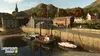 A scenic view of a harbor town with boats docked and buildings in the background. Produktbild-Vorschau
