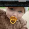 Close-up of a baby's face wearing a pacifier. Náhled obrázku produktu