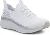 A white Skechers sneaker with a thick sole is shown from the side against a white background. Podgląd zdjęcia produktu