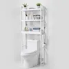 A white shelving unit is placed over a white toilet, displaying various bathroom accessories. Anteprima dell’immagine prodotto