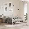 A bedroom scene with a white metal bed frame as the central focus, decorated with bedding and surrounded by wall art, a nightstand, and a floor lamp. Produktbild-Vorschau