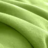 A close-up, abstract view of a folded green fleece blanket. Produktbild-Vorschau