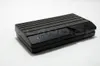 A black electronic device with a ribbed top surface is shown on a white background. Produktbild-Vorschau