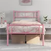 A pink metal bed frame with a mattress and bedding is shown in a bedroom setting. Produktbild-Vorschau