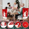 A family is enjoying a Christmas dinner, with festive chair covers on the chairs. Produktbild-Vorschau