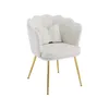 A single beige armchair with gold legs and a small white pillow. Náhled obrázku produktu