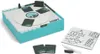 A party board game with its components, including cards, a drawing board, and a marker, displayed on a white background. Produktbild-Vorschau