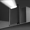 A black power bank with its LED flashlight on, casting a bright beam of light upwards against a dark background. Produktbild-Vorschau