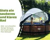 Two children are playing in a round wooden pool covered by a transparent canopy. Produktbild-Vorschau