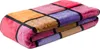 A folded blanket with a patchwork design. Produktbild-Vorschau