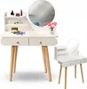 A white vanity table with a round mirror and a matching stool, set against a white background. Anteprima dell’immagine prodotto