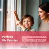 A mother and child are decorating a window with string lights. Anteprima dell’immagine prodotto