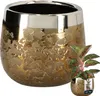 A gold ceramic planter with a textured, reflective surface and a silver rim, shown with a small potted plant in the lower right corner. Produktbild-Vorschau