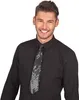 A man wearing a black shirt and a sequined tie against a white background. Produktbild-Vorschau